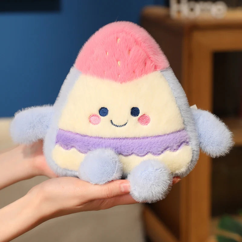 Plush toy resembling a cake slice held in hands with a blurred background