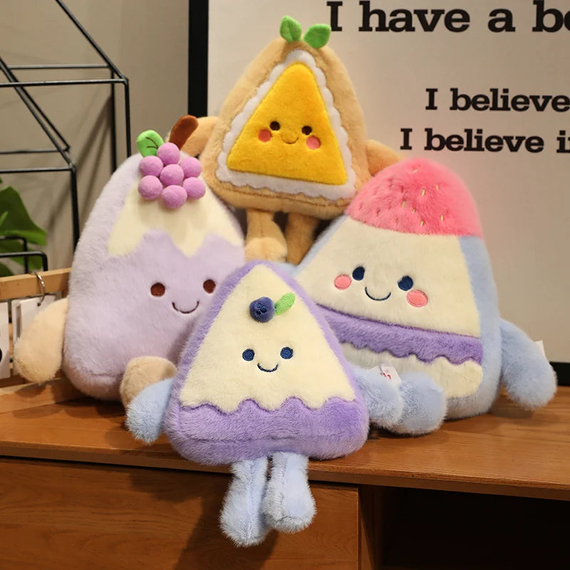 Plush toys shaped like fruit slices on a wooden surface with a blurred background.