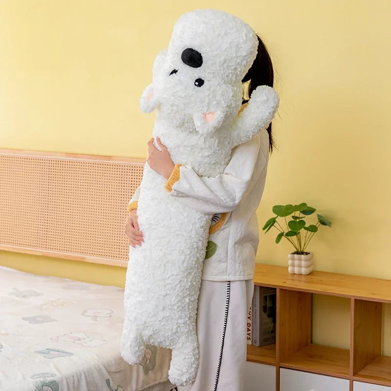 Person holding a large white dog plushie toy against a yellow wall.