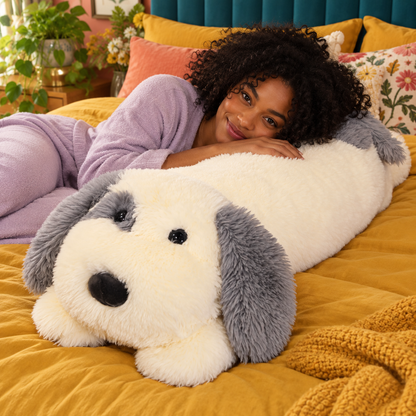 Adult relaxing beside the 100cm / 3.3-foot cream and gray sheepdog body pillow on mustard bedding in a colorful bedroom.