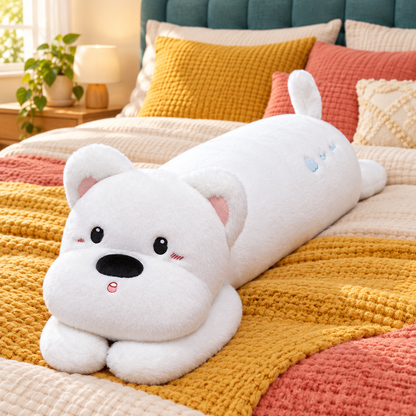 Snow white long puppy plush body pillow with black oval eyes, a rounded white muzzle, small front paws, and upright tail displayed on colorful bedding.