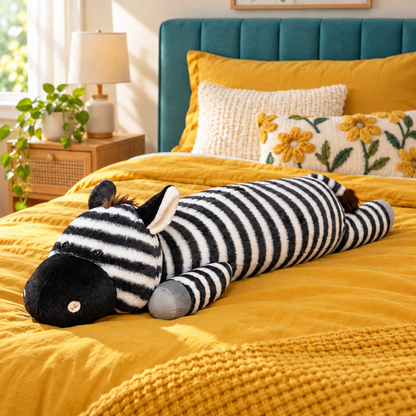 90cm / 3-foot zebra plush body pillow stretched across a mustard bed, showing its long striped body, black muzzle, brown mane, gray hooves and tail.
