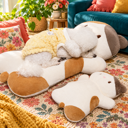 Small dog resting on a Calico lying cat plush pillow beside the smaller size.