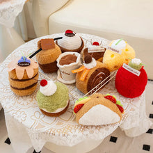 Plush toys shaped like food items on a lace tablecloth