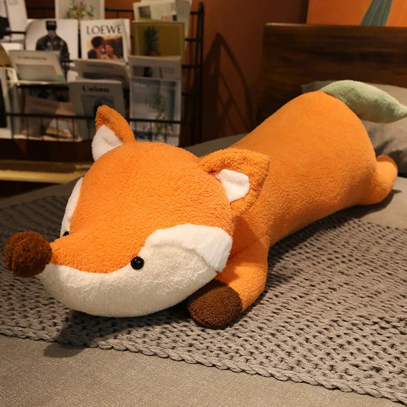 Plush fox toy on a textured surface with a magazine rack in the background