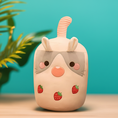 Cute cartoon-style boba rabbit plushie with strawberry designs on a teal background
