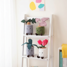 White ladder shelf with plush plant decorations against a light wall.