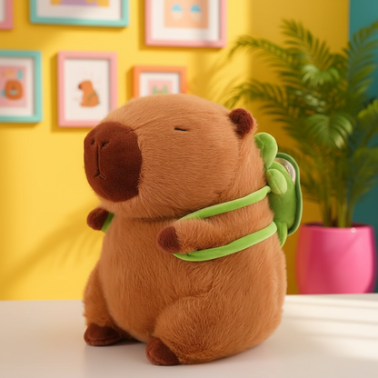 Brown plush capybara with a green backpack on a yellow wall with framed pictures and a plant.