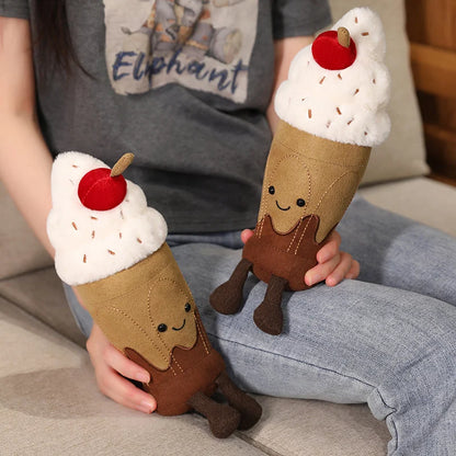 Two plush ice cream cone toys held by a person sitting on a couch.