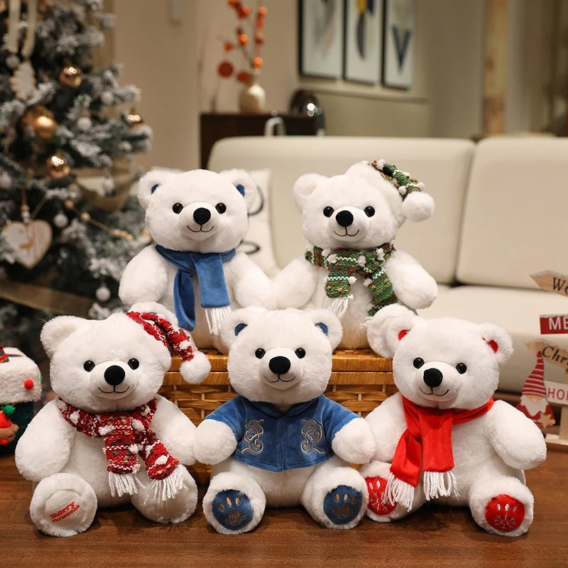 White teddy bears with scarves in front of a decorated Christmas tree and couch.
