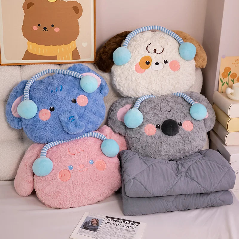 Four plush toys shaped like animals with colorful ears and faces on a bed.