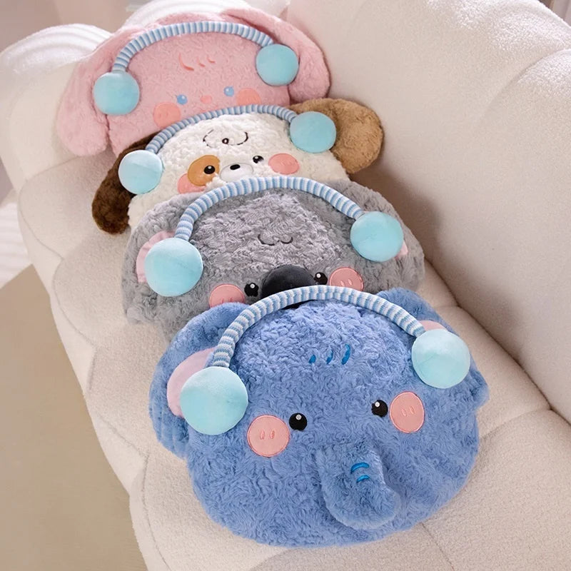 Set of plush animals in blue, gray, and pink on a light background