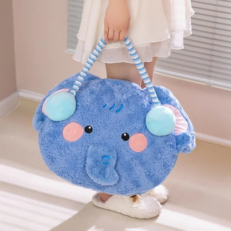 Blue plush bag shaped like a cartoon character held by a person in a white dress.