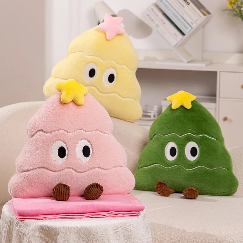 Three colorful plush toys shaped like cartoon Christmas trees on a couch.