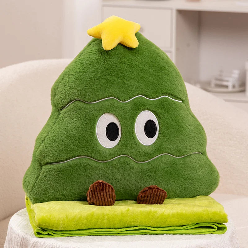 Green Christmas plush toy with a star on its head, sitting on a white surface.