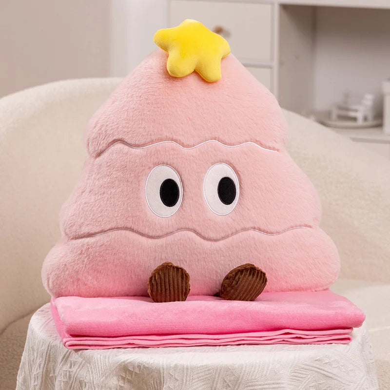 Pink Christmas tree plush toy with a yellow star on top, sitting on a white surface.