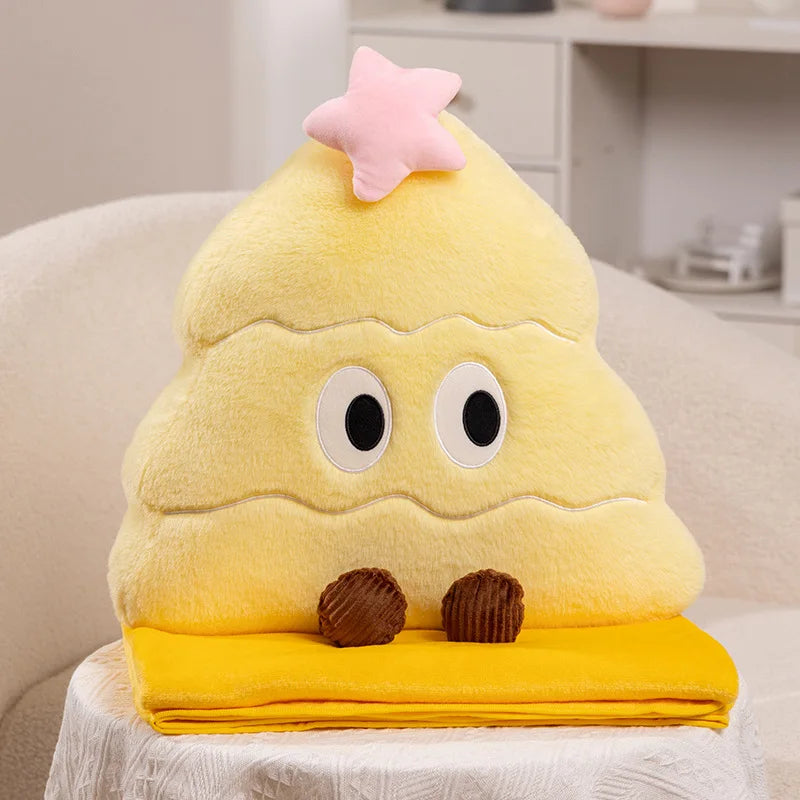 Yellow Christmas tree plush toy with a star on top, sitting on a white surface.