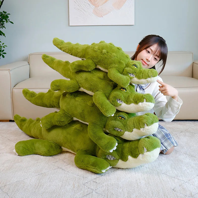 Person holding a large green crocodile plush toy alligator in a living room.