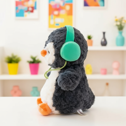Plush toy penguin with green headphones on a white surface with a colorful blurred background