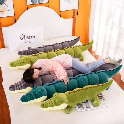 Person lying on a bed with multiple crocodile-shaped plushie body pillows.