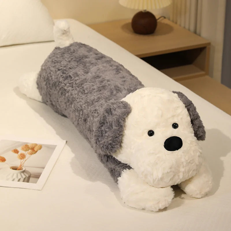 Dog-shaped pillow on a bed with a nightstand in the background