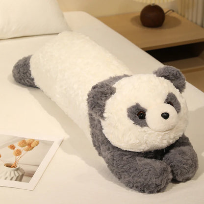 Plush panda toy on a couch in a cozy living room setting