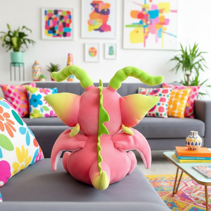 Pink and green plush toy on a couch with colorful pillows and abstract art in the background