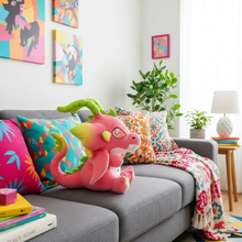 Colorful living room with a pink dragon plush toy on a gray sofa.