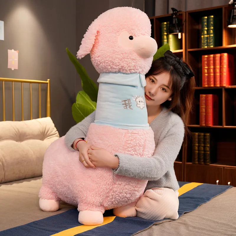 Person holding a large pink plush toy in a room with books and a bed.