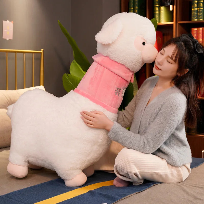 Woman hugging a large plush sheep toy in a cozy room.