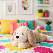 Plush dog toy on a colorful bedspread with a room in the background
