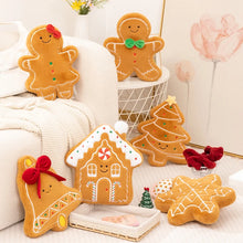 Gingerbread Plushie Series style Christmas plushies arranged on a white couch.