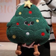 Plush toy shaped like a Christmas tree held by a person