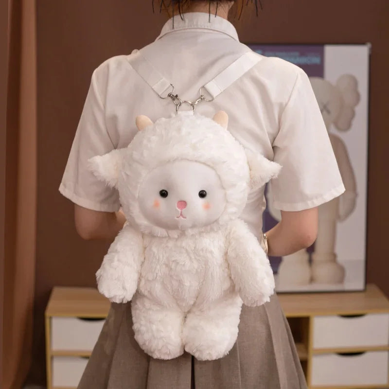 Person wearing a fluffy white sheep plushie backpack with animal ears and a face.
