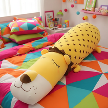 Colorful bedding set with a lion-shaped pillow in a child's bedroom.