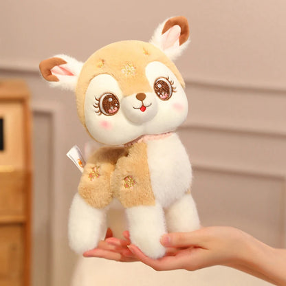 Plush toy deer held in a hand with a neutral background