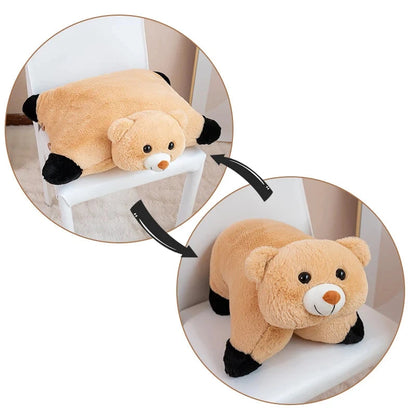 Plush bear toy on a white surface with a close-up inset showing details.