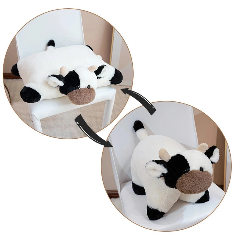 Plush cow toy with black and white pattern on a white background
