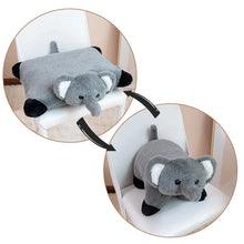 Gray elephant plush toy on a white chair with a close-up inset.