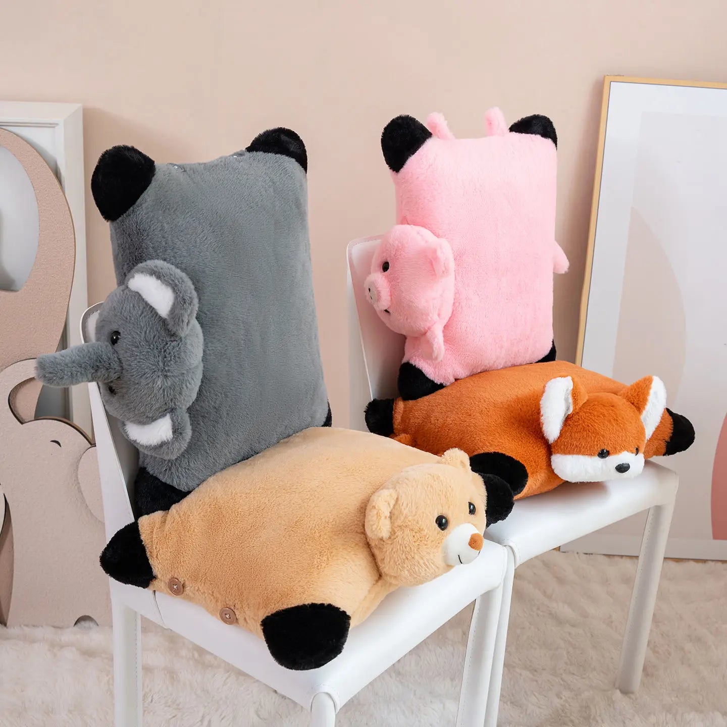 Plush animal-shaped cushions on a chair against a neutral wall.
