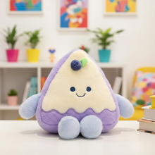 Plush toy with a happy face on a table in a colorful room