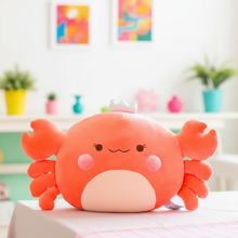 Plush crab toy on a table with a colorful room background
