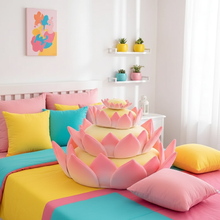 Colorful bedroom with pink lotus-shaped pillows and multicolored bedding.