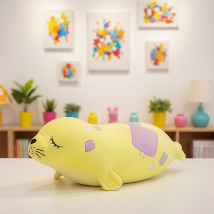 Yellow plush toy resembling a seal on a bed with colorful decorations in the background