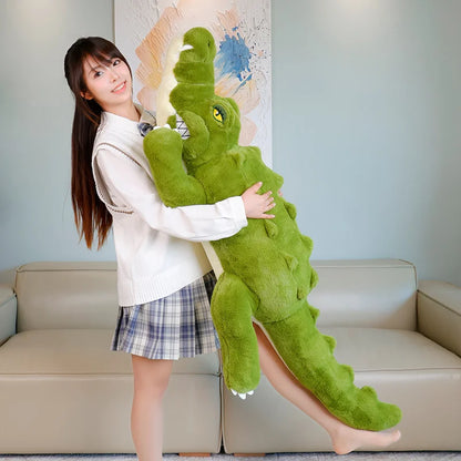 Person holding a large green crocodile plush toy in a living room setting