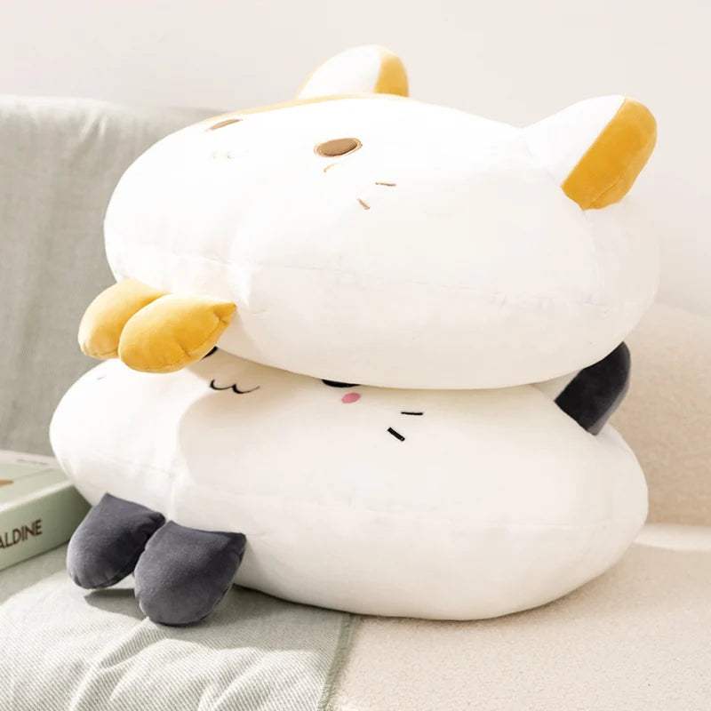 Plush toy resembling a cartoon cat on a light-colored surface