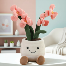 Plush toy flower pot with pink flowers on a white surface