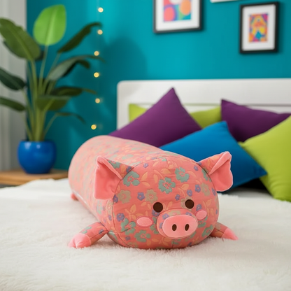 Floral-patterned pink pig-shaped body pillow on a bed with colorful pillows and a plant in the background.