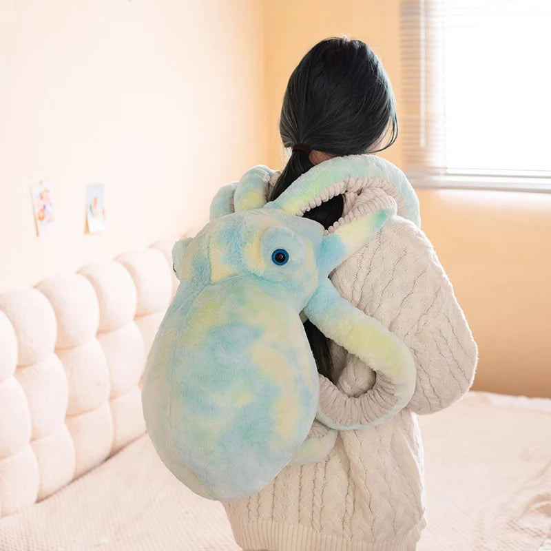 Person wearing a large, plush octopus-like creature on their back in a cozy room.