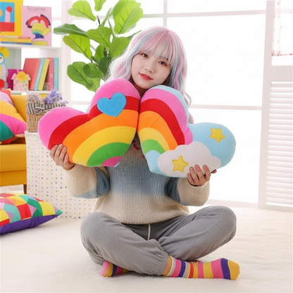 Person holding colorful heart-shaped rainbow pillows in a bright room.